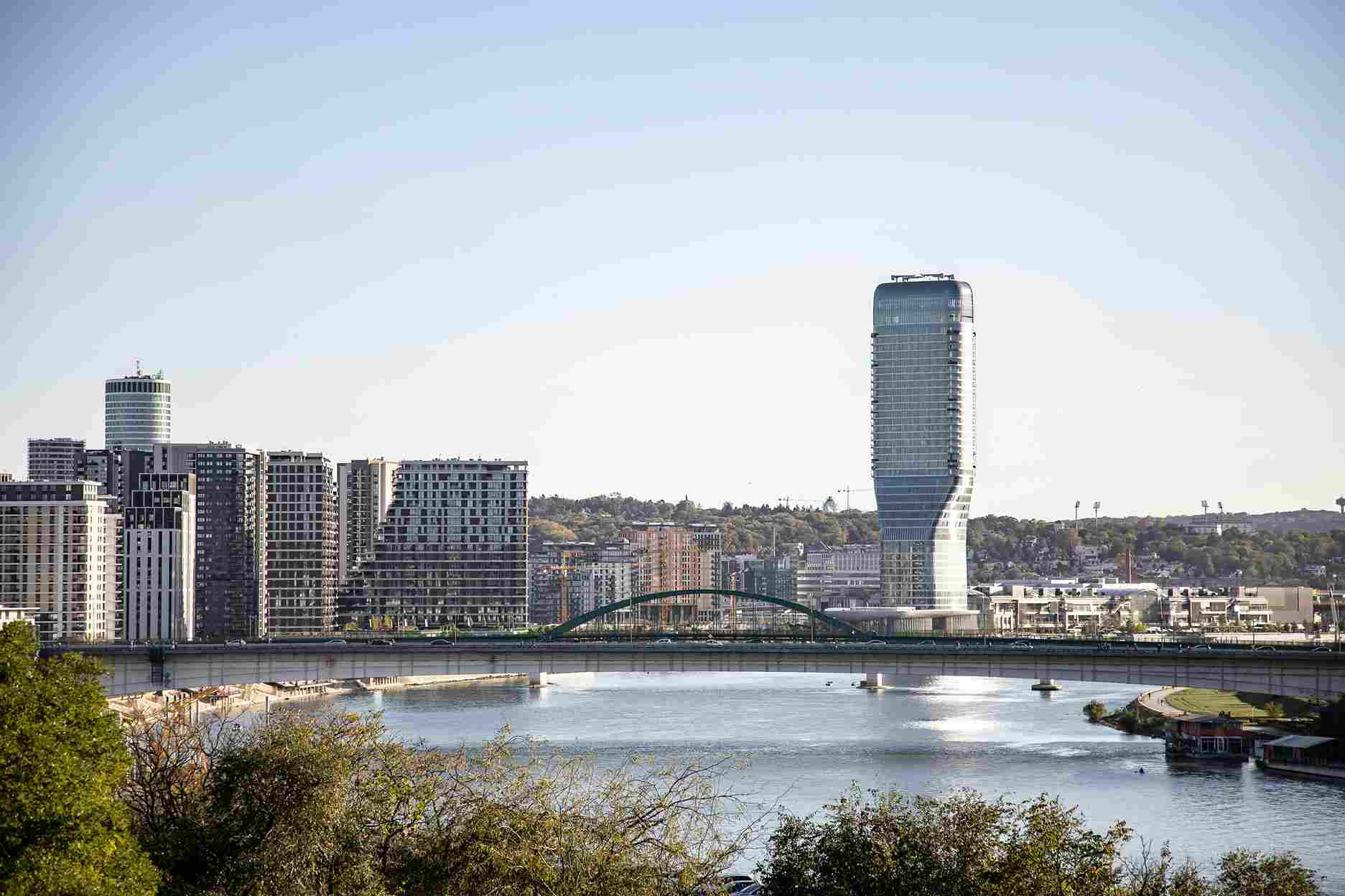 Belgrade modern skyline Sava River bridge Serbia sunny day