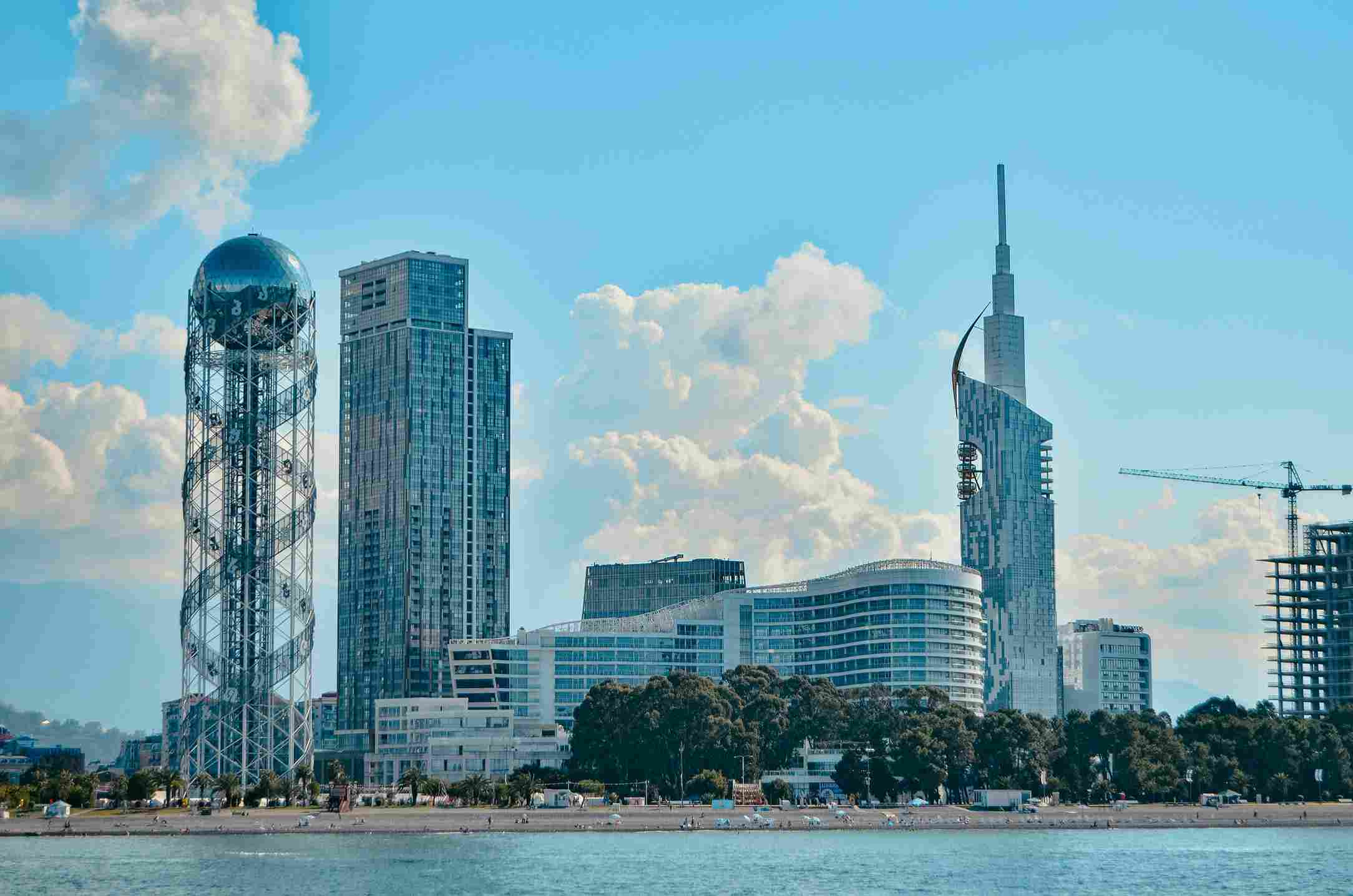Batumi city beach with Alphabet Tower and modern skyline, Black Sea, Georgia